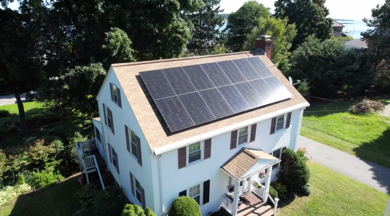 A white house with a new solar roof