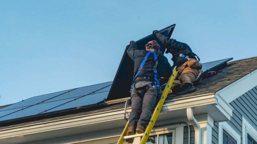 Suncovia team installing solar panels on a roof